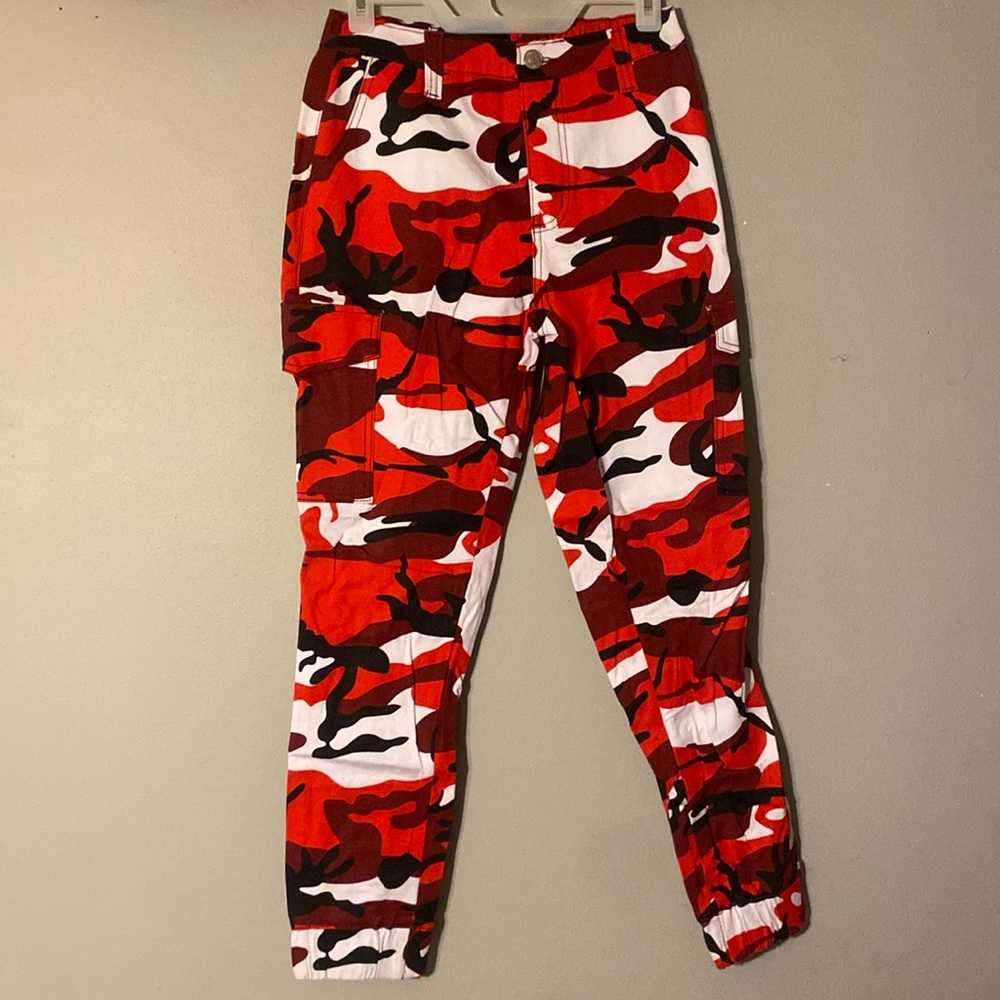 About these for a concert but never wore them. Red, White, and Black cargos